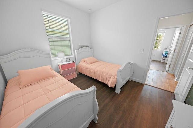 bedroom featuring dark hardwood / wood-style flooring