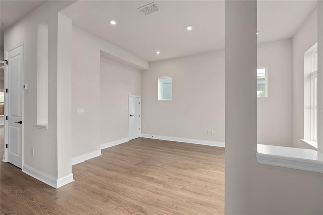 spare room with light hardwood / wood-style flooring