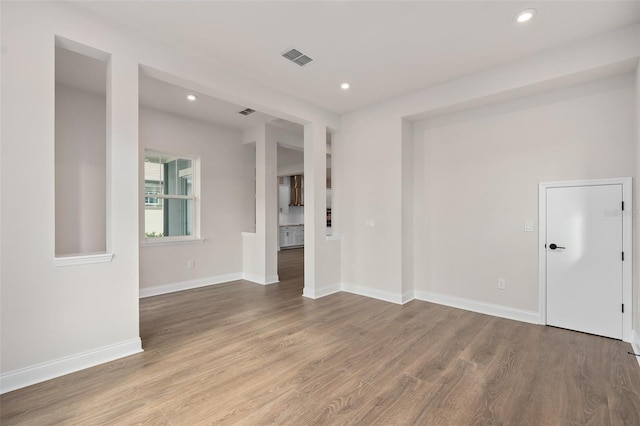 unfurnished room featuring light wood-type flooring