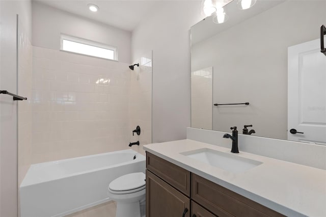 full bathroom featuring vanity, tub / shower combination, and toilet