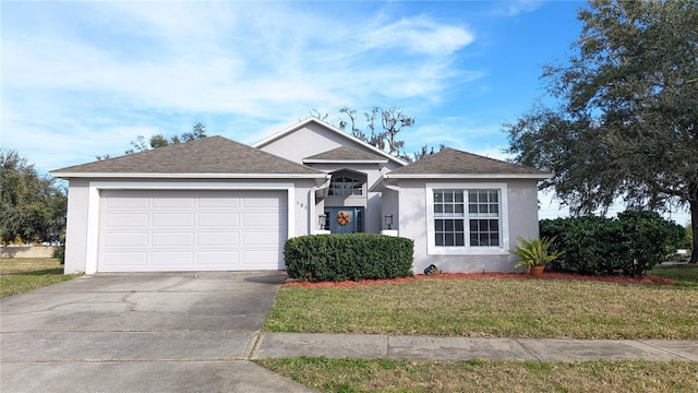 ranch-style house featuring a garage and a front lawn