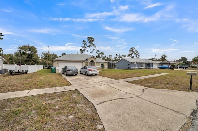 ranch-style house with a garage and a front lawn