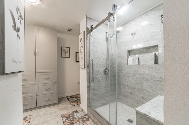 bathroom featuring an enclosed shower