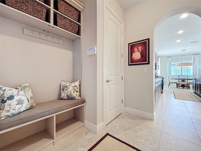 mudroom with a textured ceiling