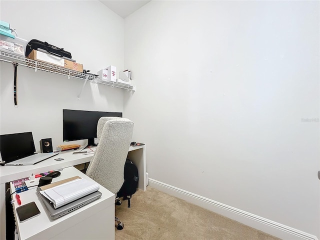 office area featuring light carpet