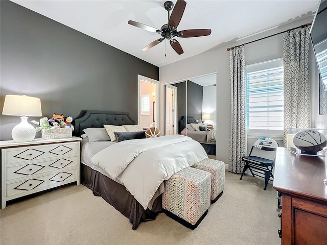 carpeted bedroom with ceiling fan