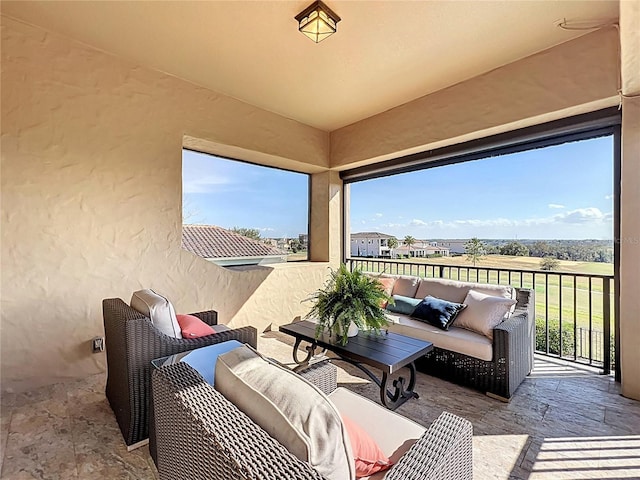 view of patio with a balcony and outdoor lounge area