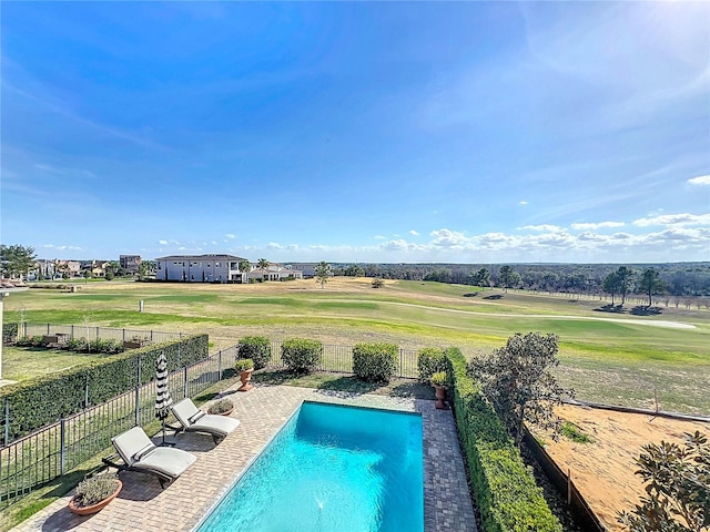 view of swimming pool featuring a yard and a patio