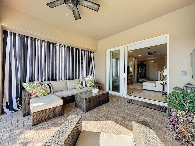 view of patio / terrace with an outdoor living space and ceiling fan