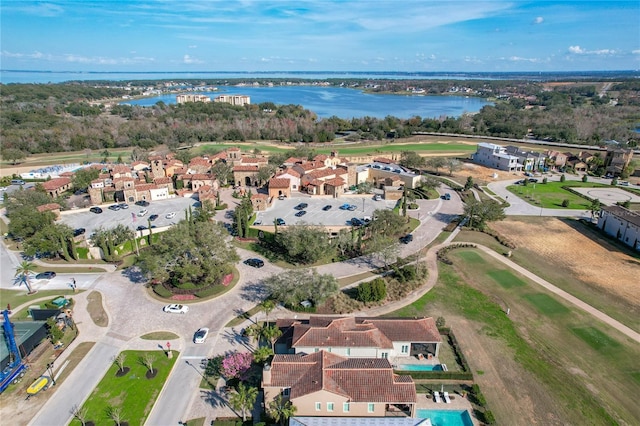 birds eye view of property with a water view