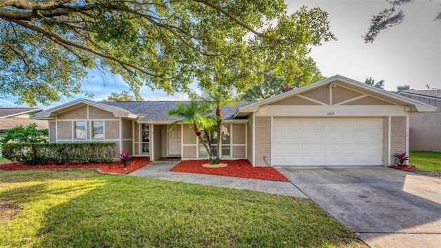 ranch-style house with a garage and a front yard