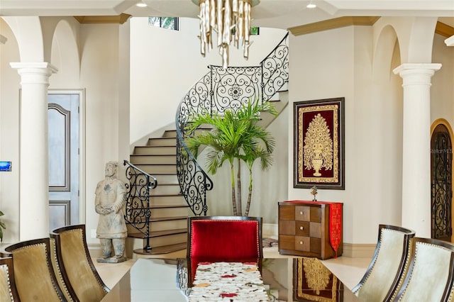 interior space featuring a chandelier and ornate columns