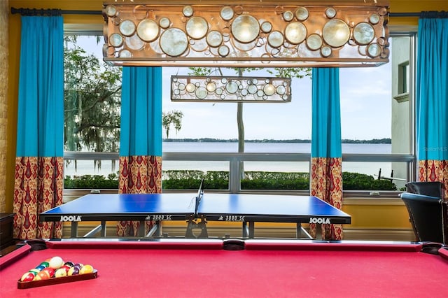 playroom featuring billiards and a water view