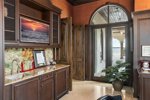 bar with wet bar and a sink