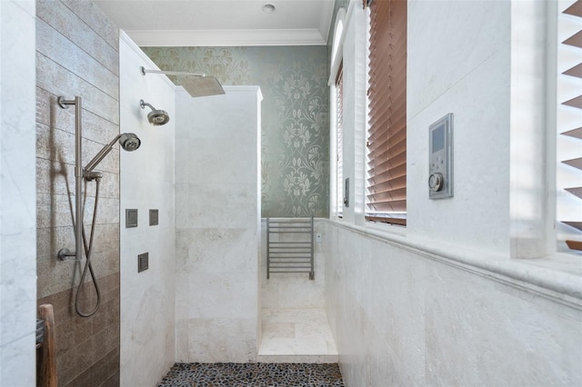 bathroom featuring wallpapered walls, crown molding, a wainscoted wall, and walk in shower