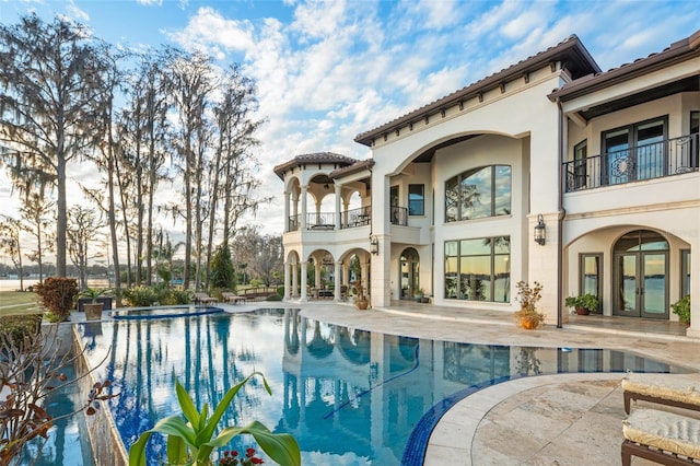 exterior space with french doors and a patio area