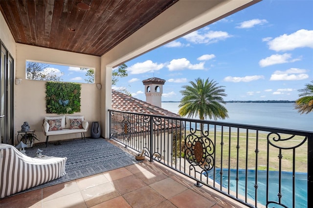 balcony featuring a water view