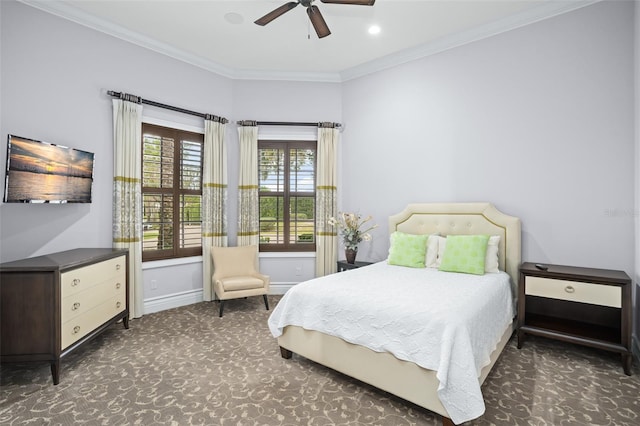 carpeted bedroom featuring baseboards, a ceiling fan, and crown molding