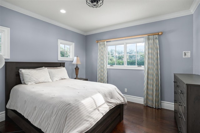 bedroom with dark wood-type flooring, recessed lighting, baseboards, and ornamental molding