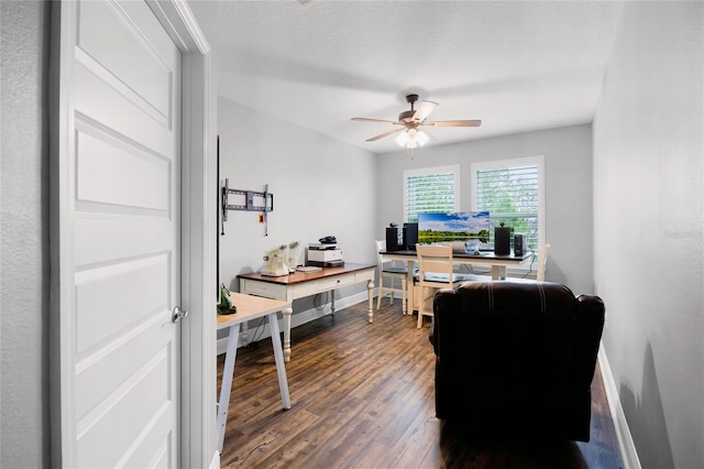 office area with dark hardwood / wood-style flooring, a textured ceiling, and ceiling fan