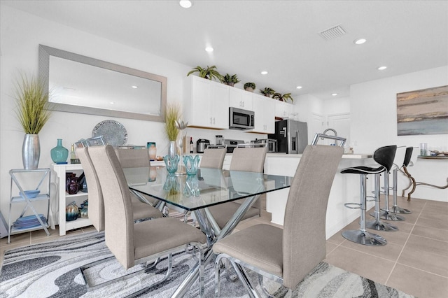 dining area with light tile patterned flooring