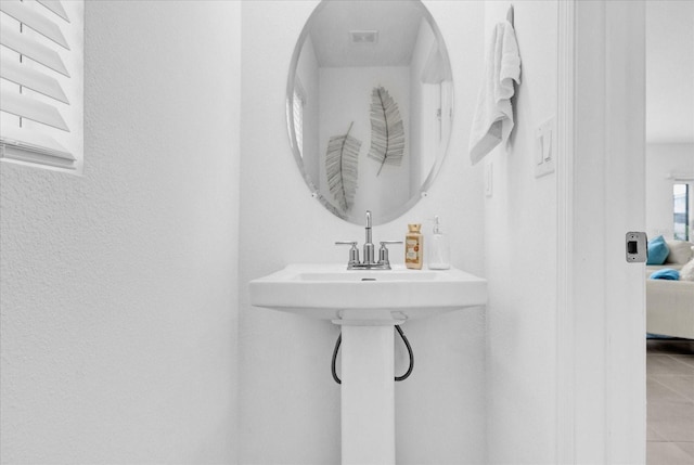 bathroom with tile patterned flooring