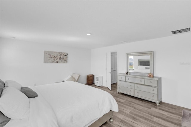 bedroom with light hardwood / wood-style floors