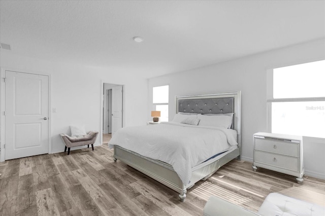 bedroom featuring light hardwood / wood-style flooring