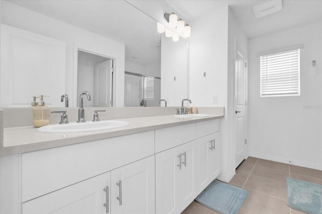 bathroom with vanity, an enclosed shower, and tile patterned flooring