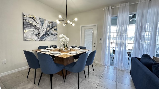 dining area with a chandelier and light tile patterned floors