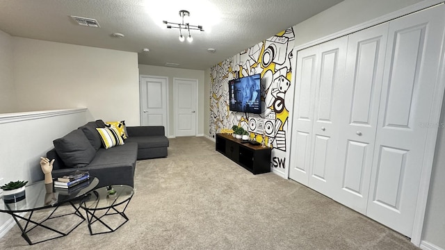 living room with light colored carpet and a textured ceiling