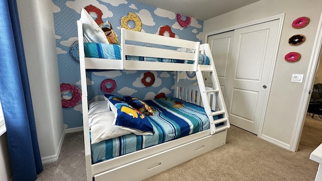 bedroom featuring carpet floors and a closet