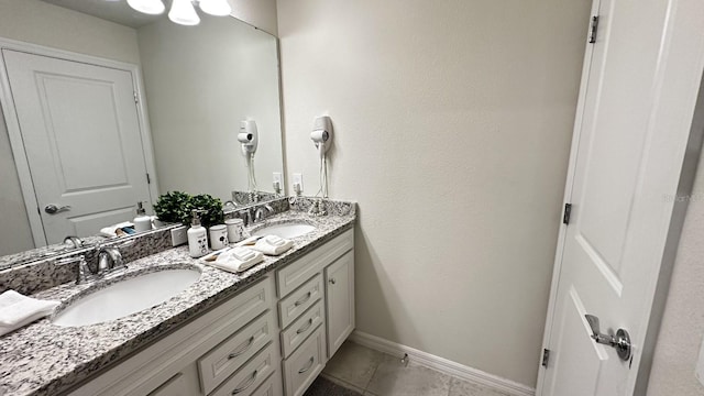 bathroom with vanity and tile patterned flooring