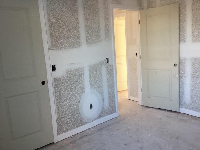 bathroom with concrete flooring