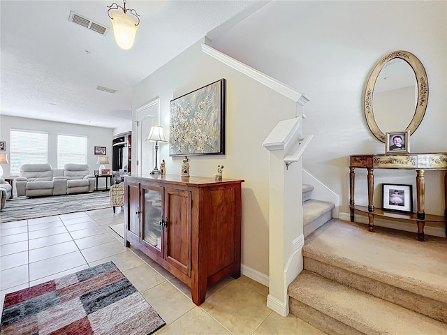 hallway featuring light tile patterned floors