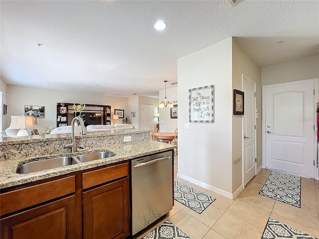 kitchen with stainless steel dishwasher, light stone countertops, sink, and light tile patterned floors