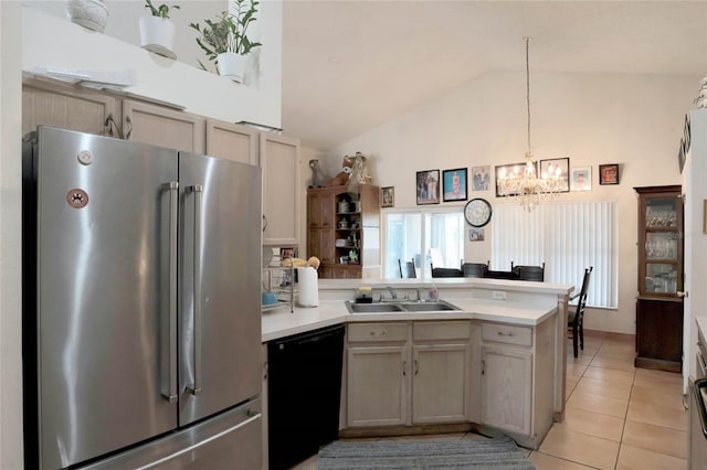 kitchen featuring dishwasher, high end fridge, a sink, and light countertops