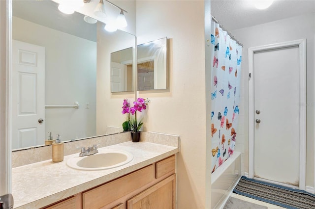 full bathroom with shower / bath combo and vanity