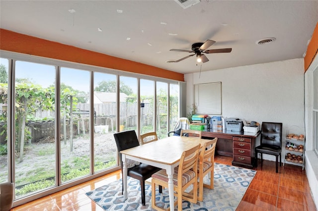 interior space featuring ceiling fan and visible vents