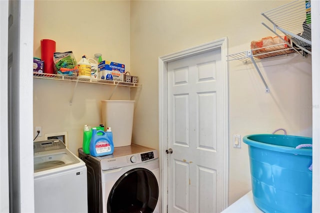 laundry room with washing machine and dryer and laundry area