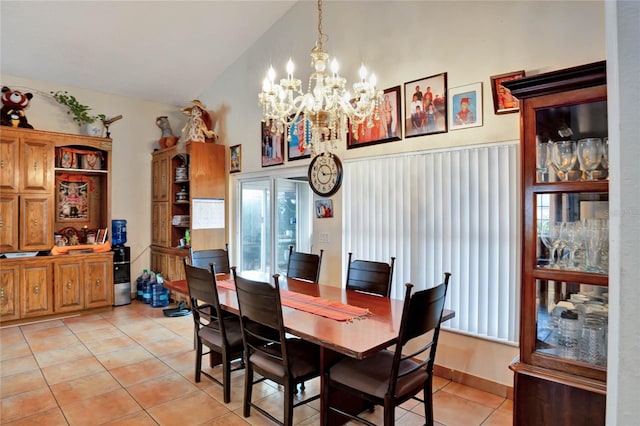 dining room with light tile patterned floors, high vaulted ceiling, and a notable chandelier