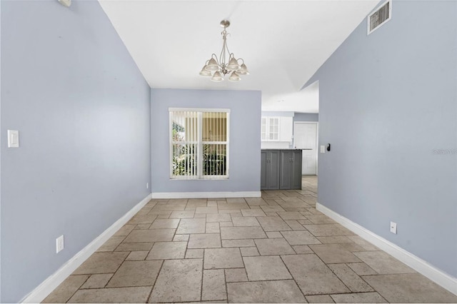 unfurnished dining area featuring an inviting chandelier