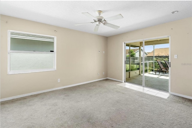 carpeted empty room with ceiling fan