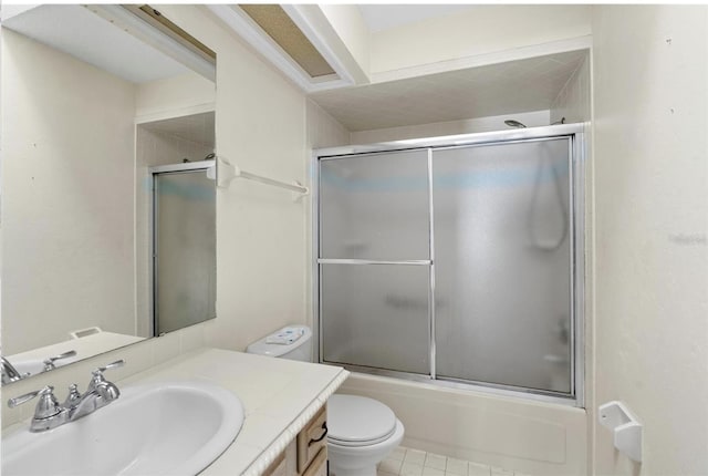 full bathroom with vanity, combined bath / shower with glass door, and toilet