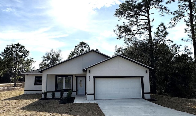 ranch-style home featuring a garage