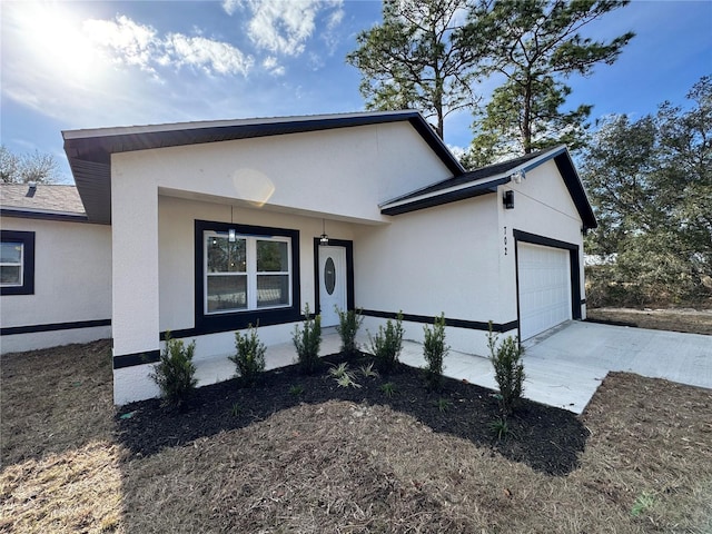 view of front of home with a garage