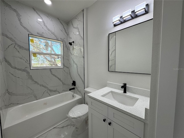 full bathroom with vanity, toilet, and tiled shower / bath combo