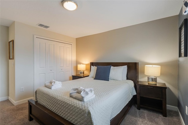 bedroom with a closet and carpet