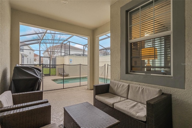 view of patio / terrace featuring an outdoor living space, grilling area, and glass enclosure