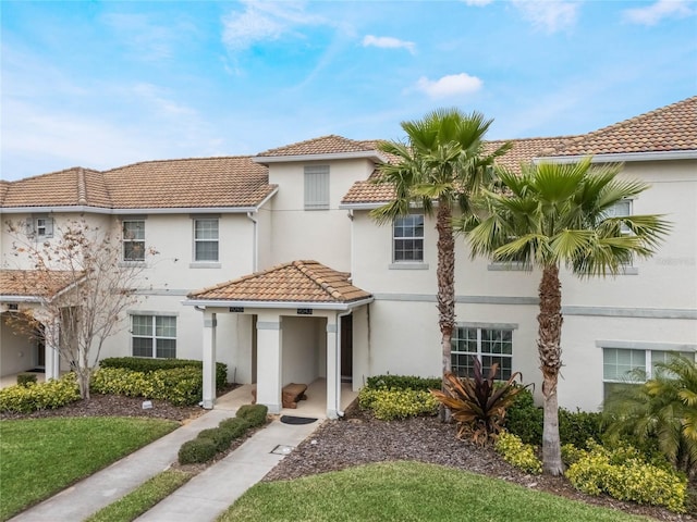 9043 Dogleg Dr, Davenport, FL 33896 - view of front facade with stucco siding and a tile roof